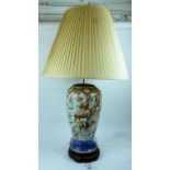 A large decorative Chinese blue and white lamp base decorated with figures amongst clouds and