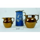 Two Victorian copper lustre jugs and a J