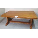 A large heavy honey oak coffee table (so