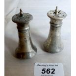 A pair of silver peppers London 1916 est