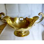 A large silver two handled gilded boat s