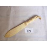 An ivory paper knife with serpent handle