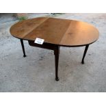 A c1900 oak pad foot drop leaf dining ta