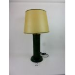 A decorative leather and ceramic lamp ba