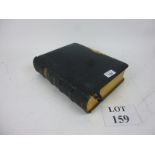 A leather bound family Holy Bible with b