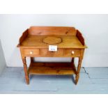 A Victorian pine wash stand with two dra