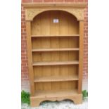 A large freestanding pine open bookcase