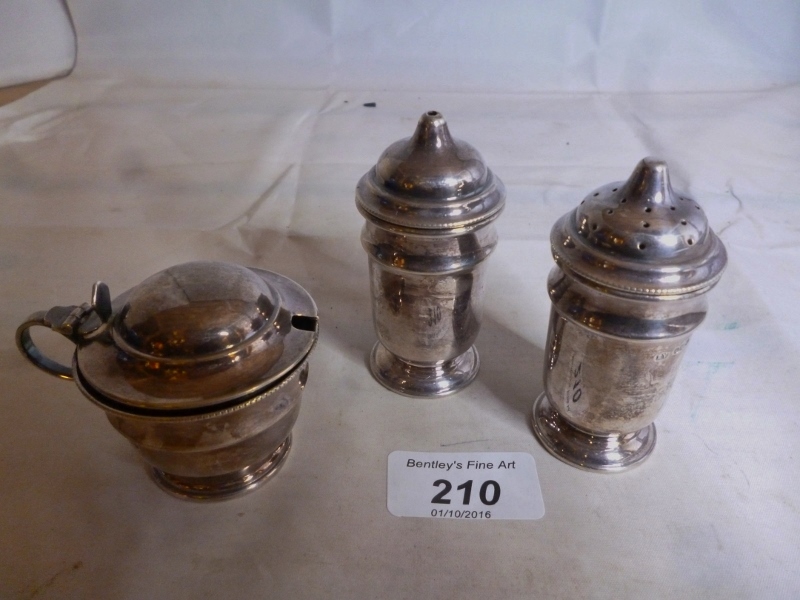 A three piece silver condiment set Sheff