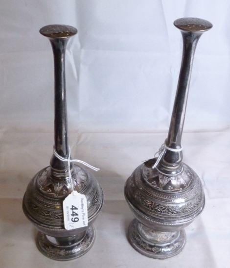 A pair of white metal rose water sprayer