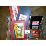 Three vintage Monopoly sets together wit