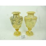 A pair of grey veined alabaster urns of