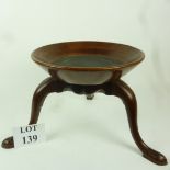 A wooden jardiniere stand est: £25-£45 (