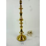 A tall gilt metal table lamp base, 64 cm