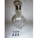 A spiral cut bulbous decanter with silve