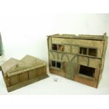 A vintage doll's house and toy garage (a