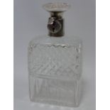A silver-mounted lockable decanter, hallmarked Birmingham 1928, by Hukin and Heath,