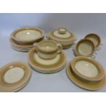 An Art Deco AJ Wilkinson Clarice Cliff Honeyglaze part dinner set comprising of a odilon shaped