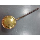 A 19th Century brass and copper warming pan, the cover with engraved bird decoration.