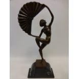 Cast Bronze figure of an Art Deco style naked female dancer holding a large fan,