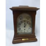 Oak cased German Kienzle Westminster chime bracket clock, silent/chime, with pendulum and key,