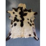 Goat skin rug, 100x76cms.