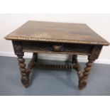 Carved oak table with hinged top to inner compartment,