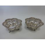 Pair of Mappin & Webb pierced silver bonbon dishes in a floral design,