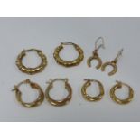 Three pairs of 9ct gold hoop earrings and a pair of 9ct horseshoe earrings, total weight, 5.4g.