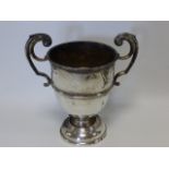 Twin handled silver trophy hallmarked London 1924 to body, makers initials CA, 19cms in height,