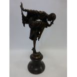 Cast Bronze after Chiparus of an Art Deco style dancing lady with snake entwined around her ankle,