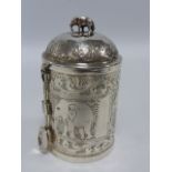 Indian silver lidded caddy with attached spoon engraved with panels of elephants,