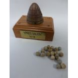 WWI fuse shell cone with quantity of shrapnel pieces, mounted of desk top display plinth,
