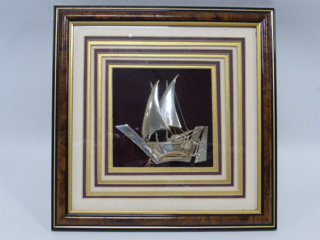 Framed silver model of a Dhow. The Dhow stamped Silver 925 measuring approximately 12cms in