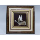 Framed silver model of a Dhow. The Dhow stamped Silver 925 measuring approximately 12cms in