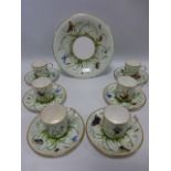 A 19th Century china coffee set comprising of 6 coffee cans, 6 saucers and a cake plate,