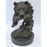 Cast Bronze after Milo of a Grizzly Bear with a Salmon, on circular marble base, 26cm high.