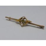 Victorian 15ct gold bar brooch set with Peridot and seed pearls, 4.5cms in length.