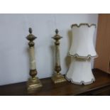 Pair of large Onyx and brass table lamps, with cream shades, approx height to bayonet fitting is 66.