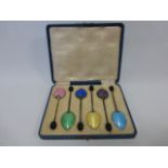 An Art Deco cased set of six silver and guilloche enamel coffee bean teaspoons,