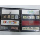 Stamps - A WH Smith FDC album with 42 GB Presentation packs 1980s including castle high value set