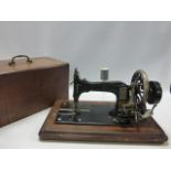 Antique Frister & Rossman sewing machine & case.
