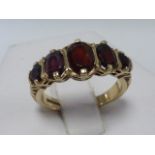 9ct gold five stone garnet ring, size O/P.