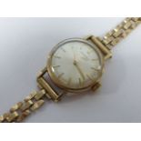 Ladies 1960's 9ct gold Longines wristwatch with pearlised dial and baton numerals, 20mm in diameter,