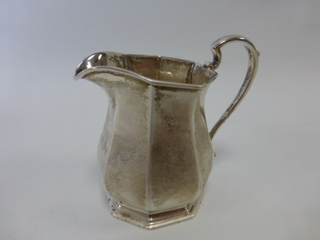 Mappin and Webb silver cream jug hallmarked Sheffield 1924, 7.7cms in height, 95.6g.