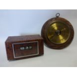 Retro snakeskin effect desk top flip clock together with an oak cased barometer.