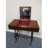 Mahogany dressing table with central mirrored compartment with hinged lid and with two frieze