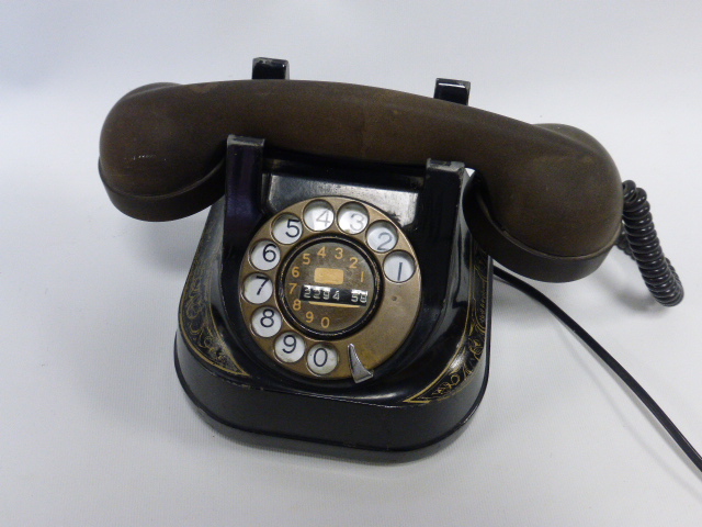 Late 1940-1950's Bell desk telephone with gilt decorated metal body and bakelite handset.