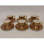 Royal Crown Derby Imari pattern set of six coffee cans with saucers.