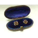 Cased set of Victorian gold studs set with pink cabochon stones, testing as 18ct, 2.1g.