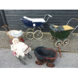 Five dolls prams of various ages, including a Silver Cross model,